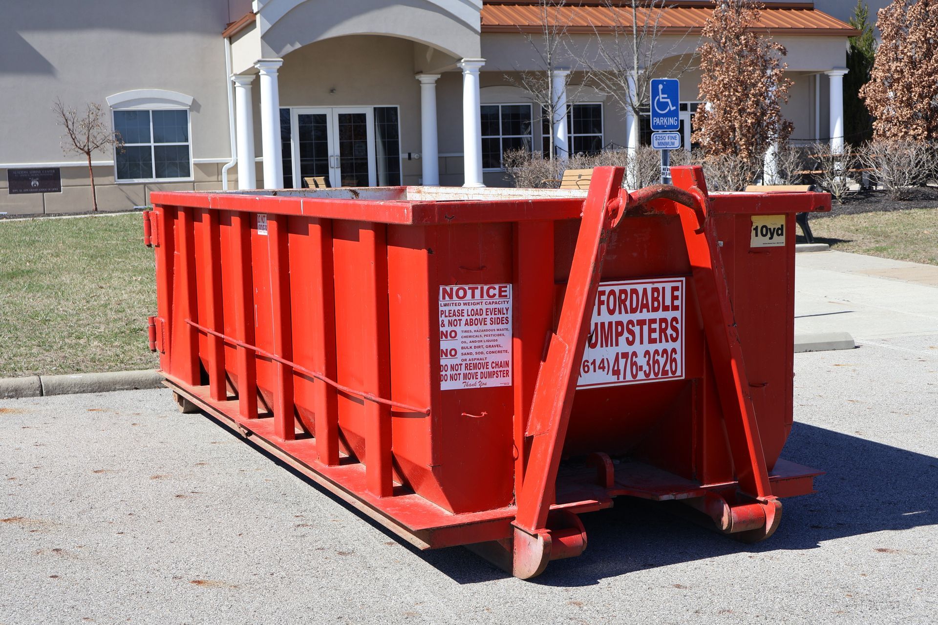 Red 20-yard dumpster labeled 