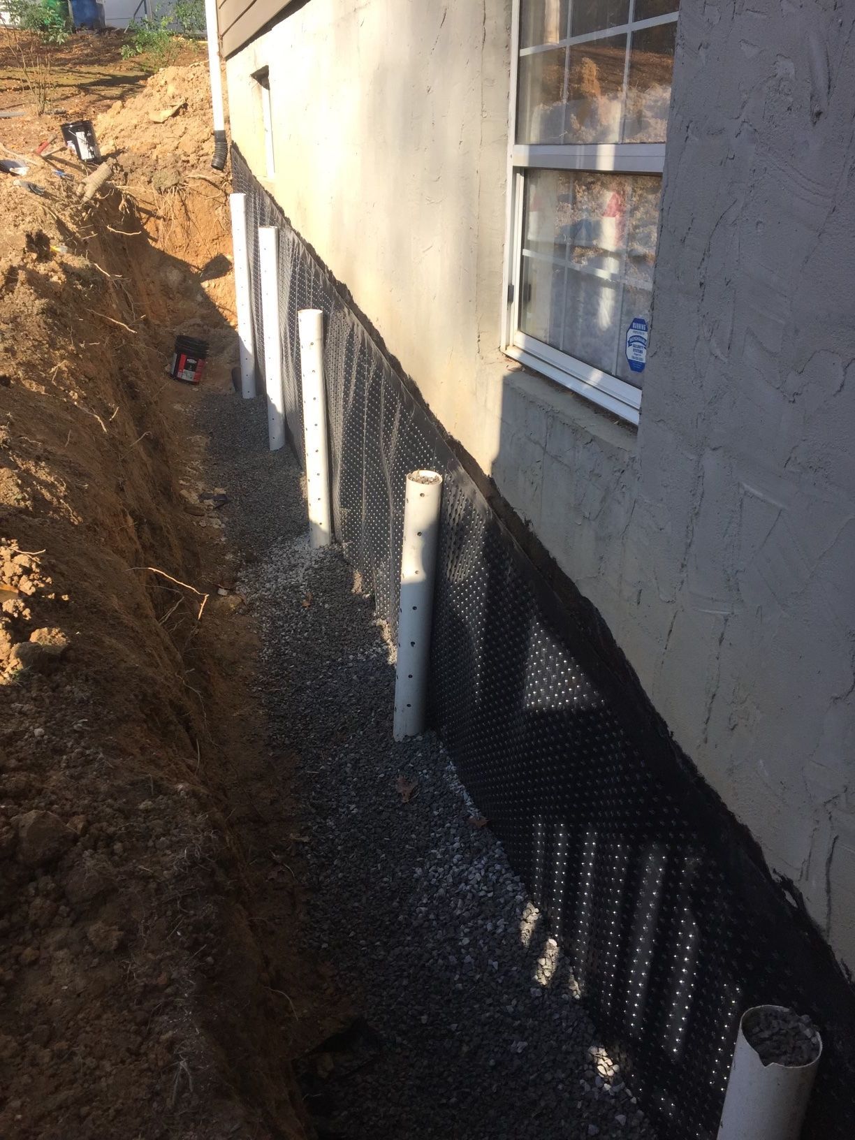 A basement with brick walls and metal beams.