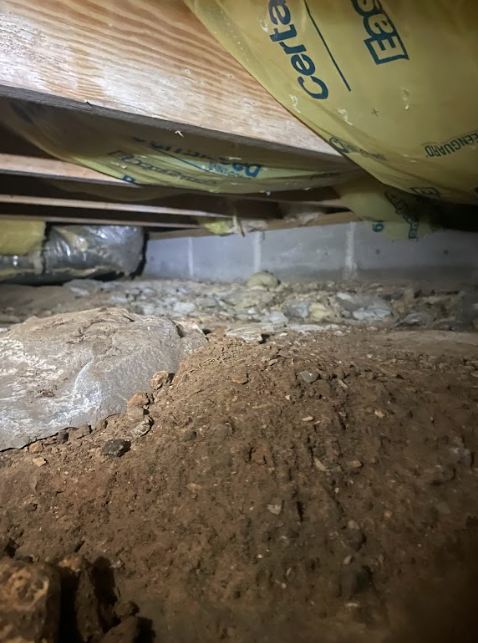 A picture of a crawl space under a house.