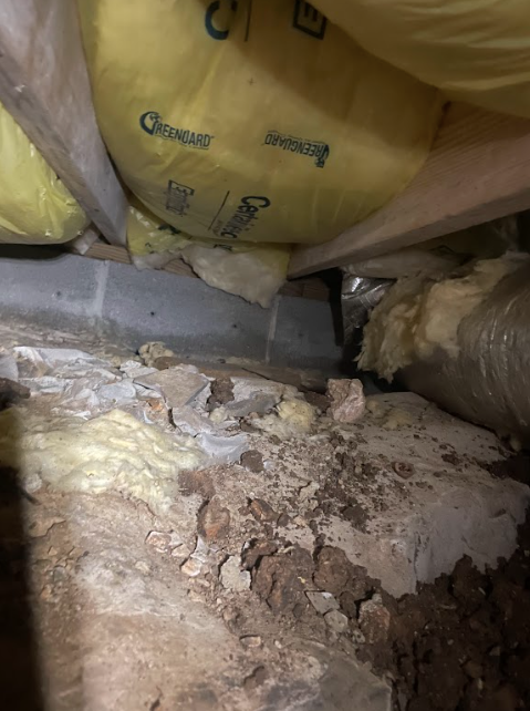There is a lot of dirt and rocks in the attic.