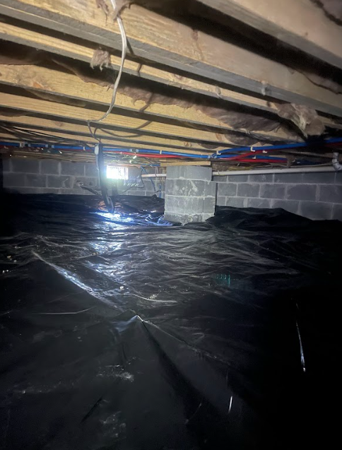 A basement with a lot of water coming out of it.