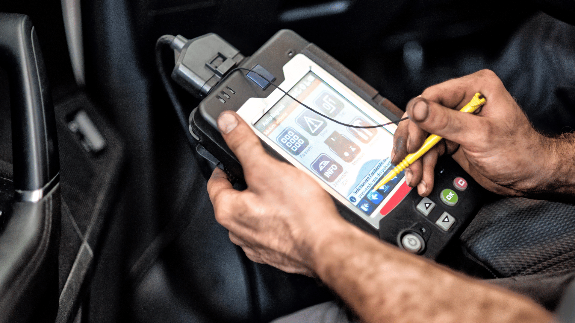 a small speaker sits on a wooden shelf next to a plant
