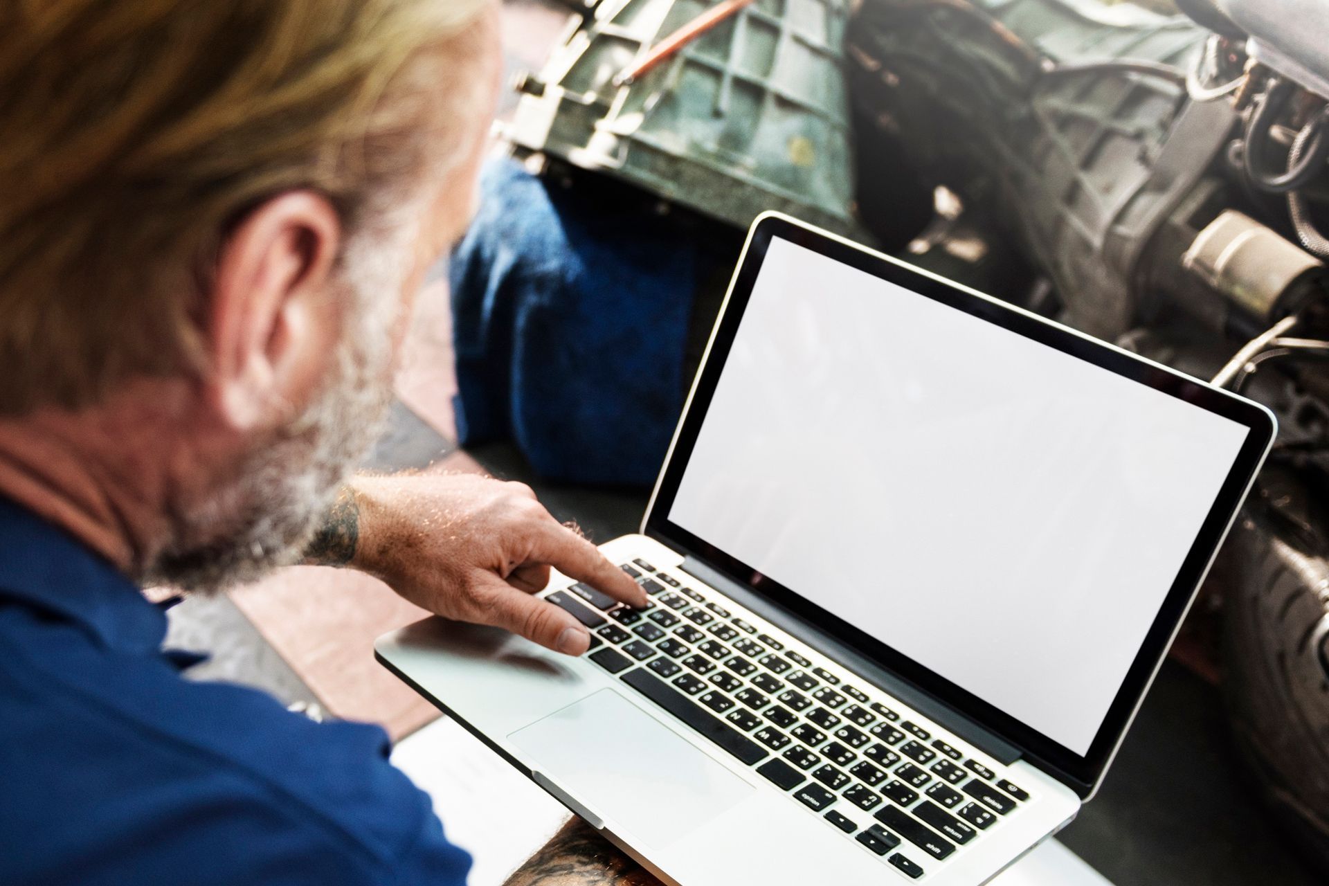 man holding a laptop