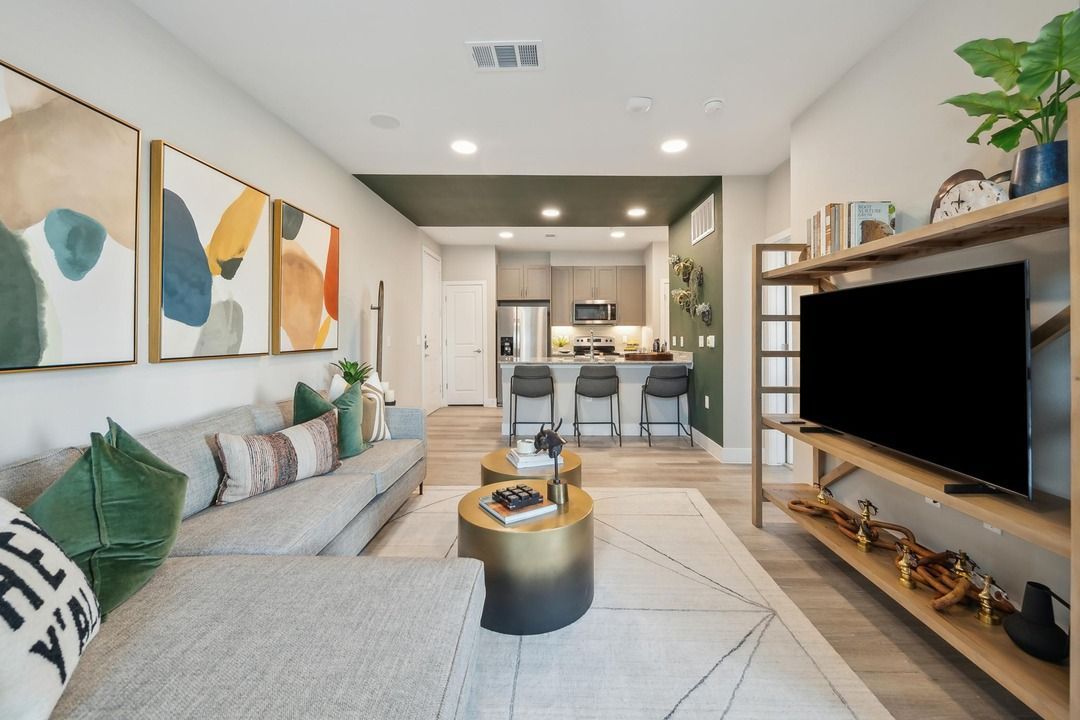 A living room with a couch and a flat screen tv