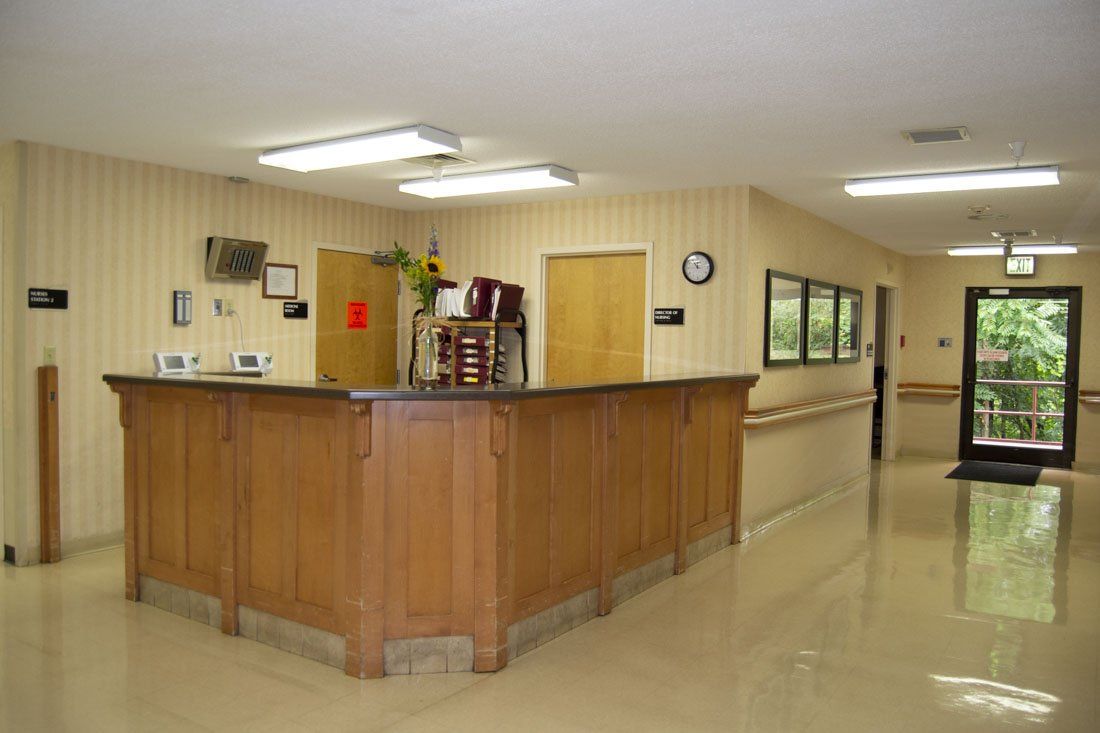 A long hallway with a wooden counter in the middle