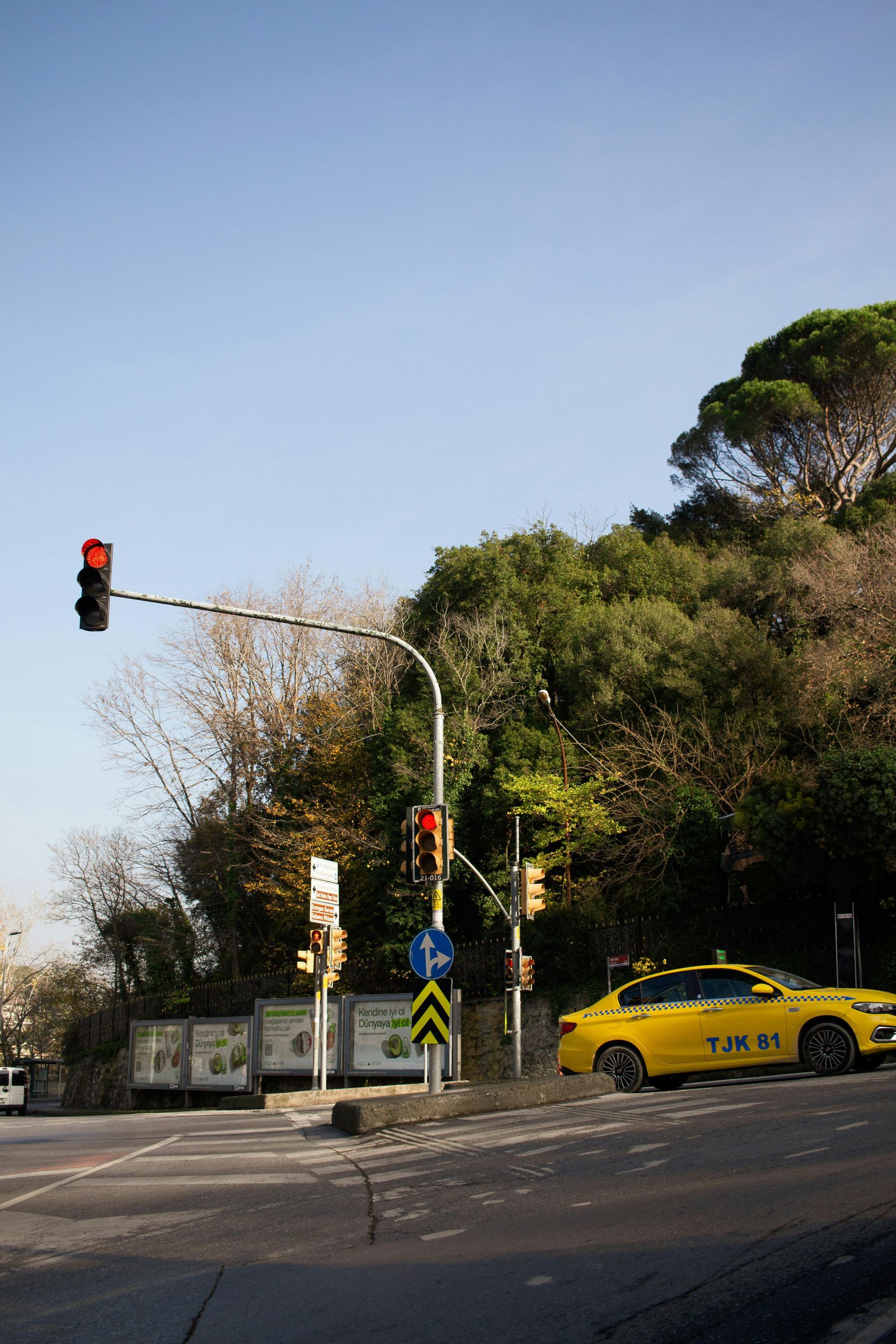 A man in a blue shirt and tie is using a laptop computer.
