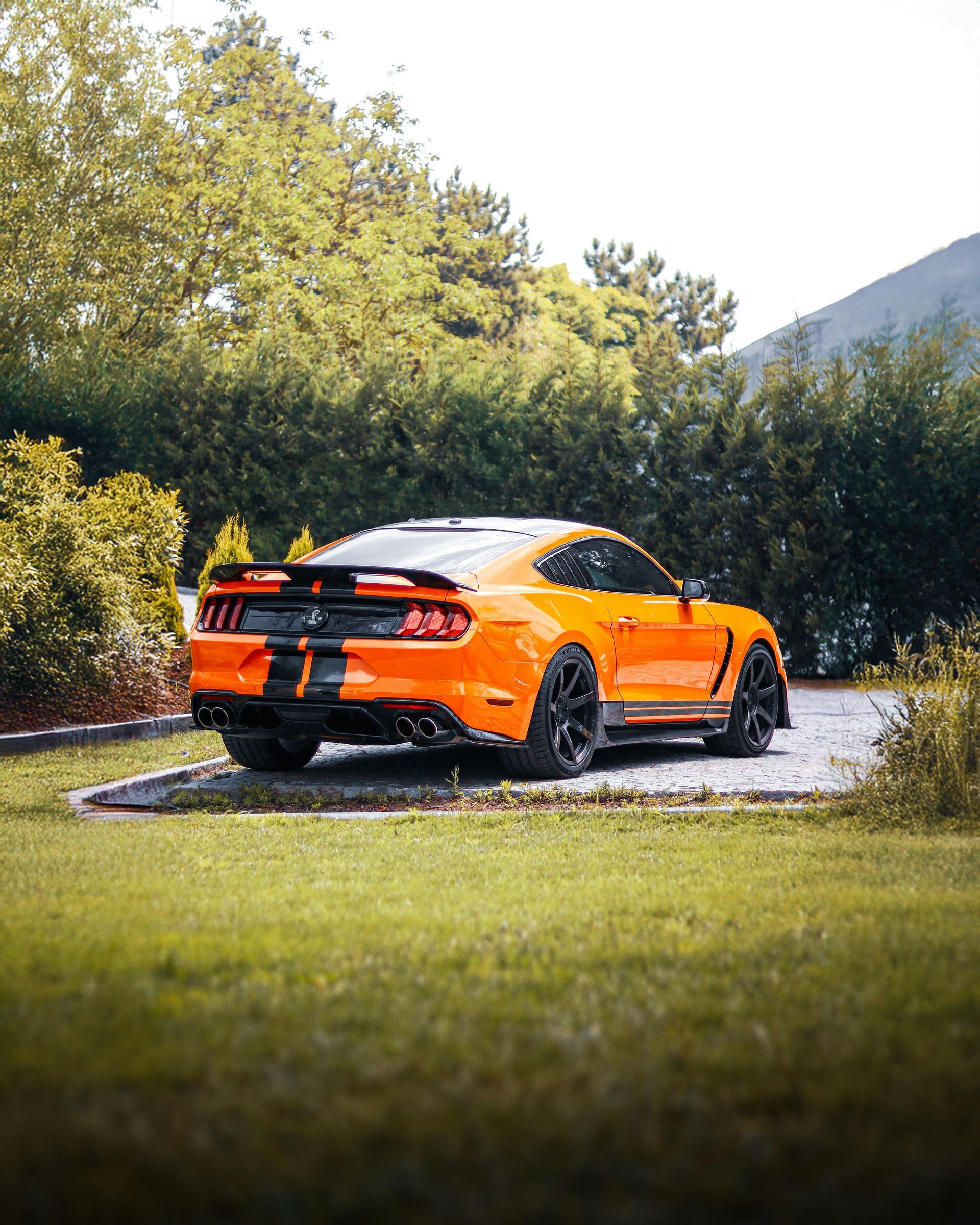 A man in a blue shirt and tie is using a laptop computer.