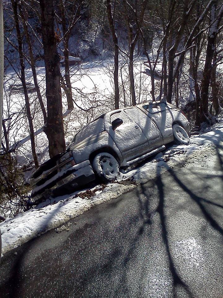 Car on the side of the road cover with snow — Pigeon Forge, TN — Carr's Auto Service