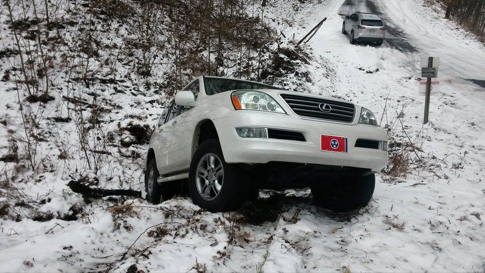 White car stuck in the snow — Pigeon Forge, TN — Carr's Auto Service