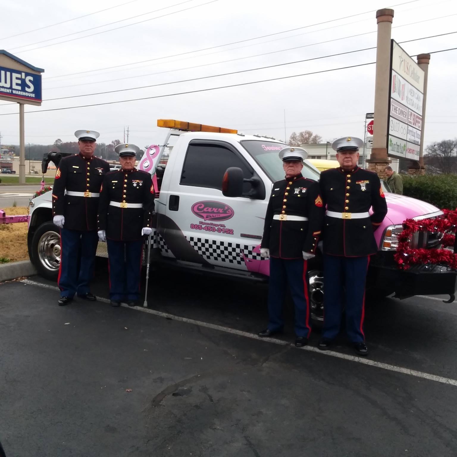 Men standing beside a tow truck — Pigeon Forge, TN — Carr's Auto Service