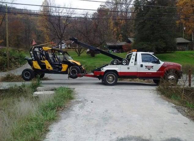 Tow truck towing a car — Pigeon Forge, TN — Carr's Auto Service