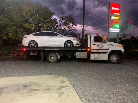 Tow truck tow a white car — Pigeon Forge, TN — Carr's Auto Service