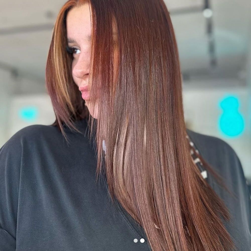 A Woman With Long Brown Hair is Wearing a Black Sweater — Hairenvy in Ettalong Beach, NSW