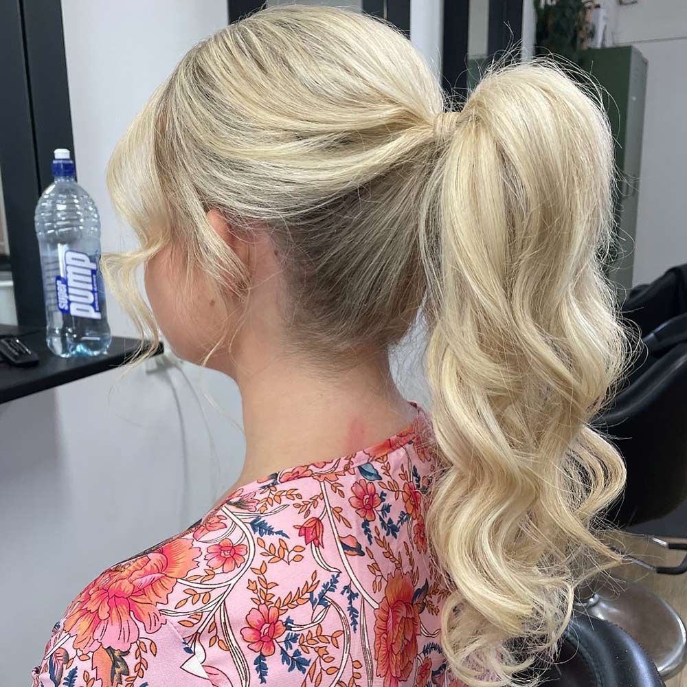 A Woman With Blonde Hair is Wearing a Pink Shirt and a Ponytail — Hairenvy in Ettalong Beach, NSW