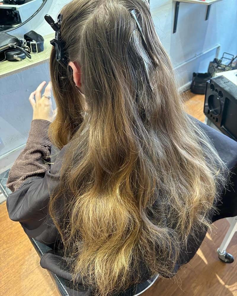 a Woman is Sitting in a Chair Inside the Salon — Hairenvy in Ettalong Beach, NSW