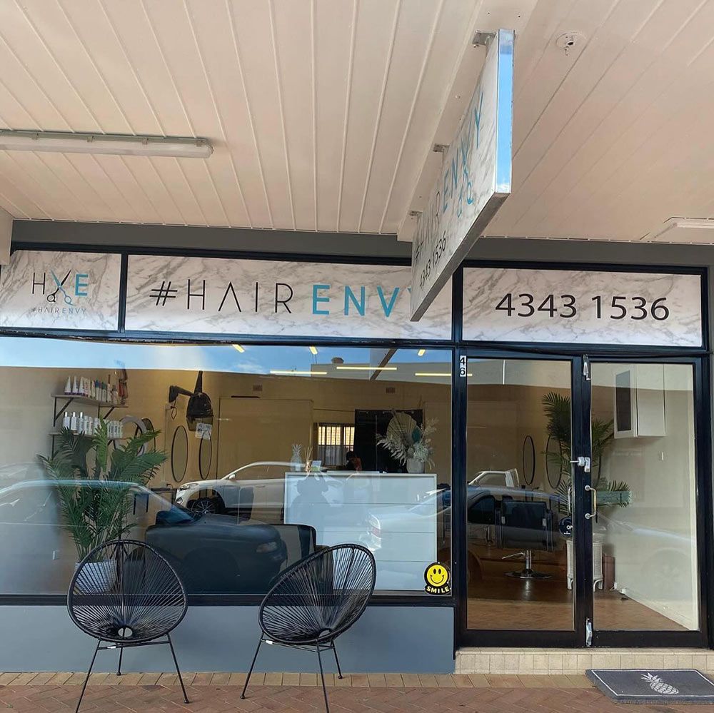 The Front of a Hair Salon With Chairs in Front of It — Hairenvy in Ettalong Beach, NSW