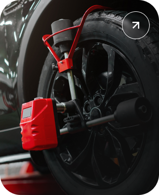 Red anti-theft wheel lock on a black car tire. | Kelly Automotive
