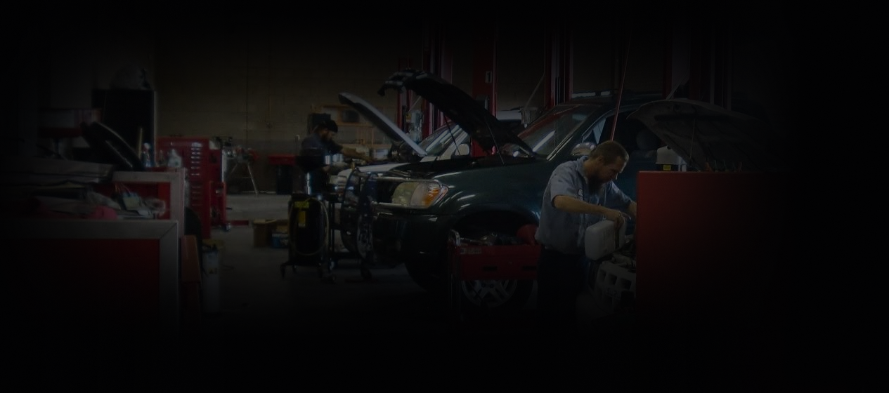Dimly lit auto repair shop | Kelly Automotive