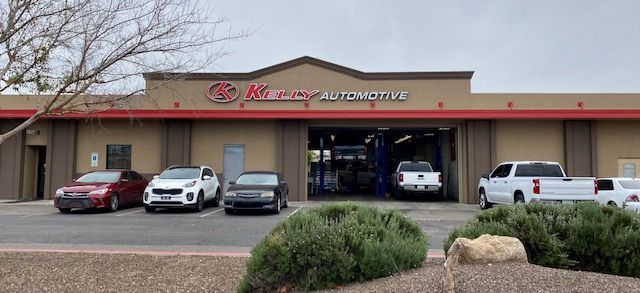 Auto service storefront with several parked vehicles | Kelly Automotive