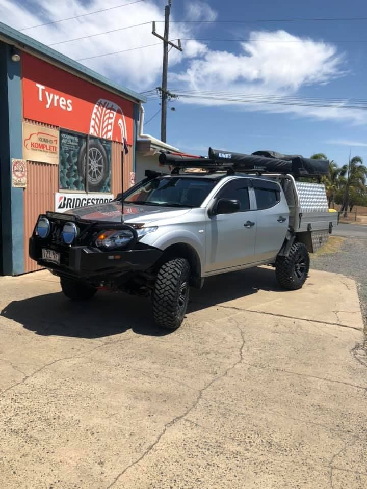 A Car With New Tyres Outside A Workshop — Bernie's Tyres In Kawana, QLD