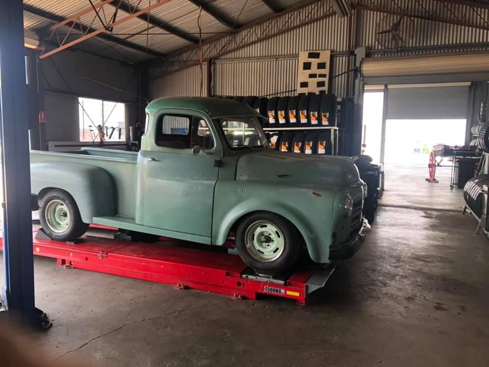 An Old Fashioned Car In A Workshop — Bernie's Tyres In Kawana, QLD