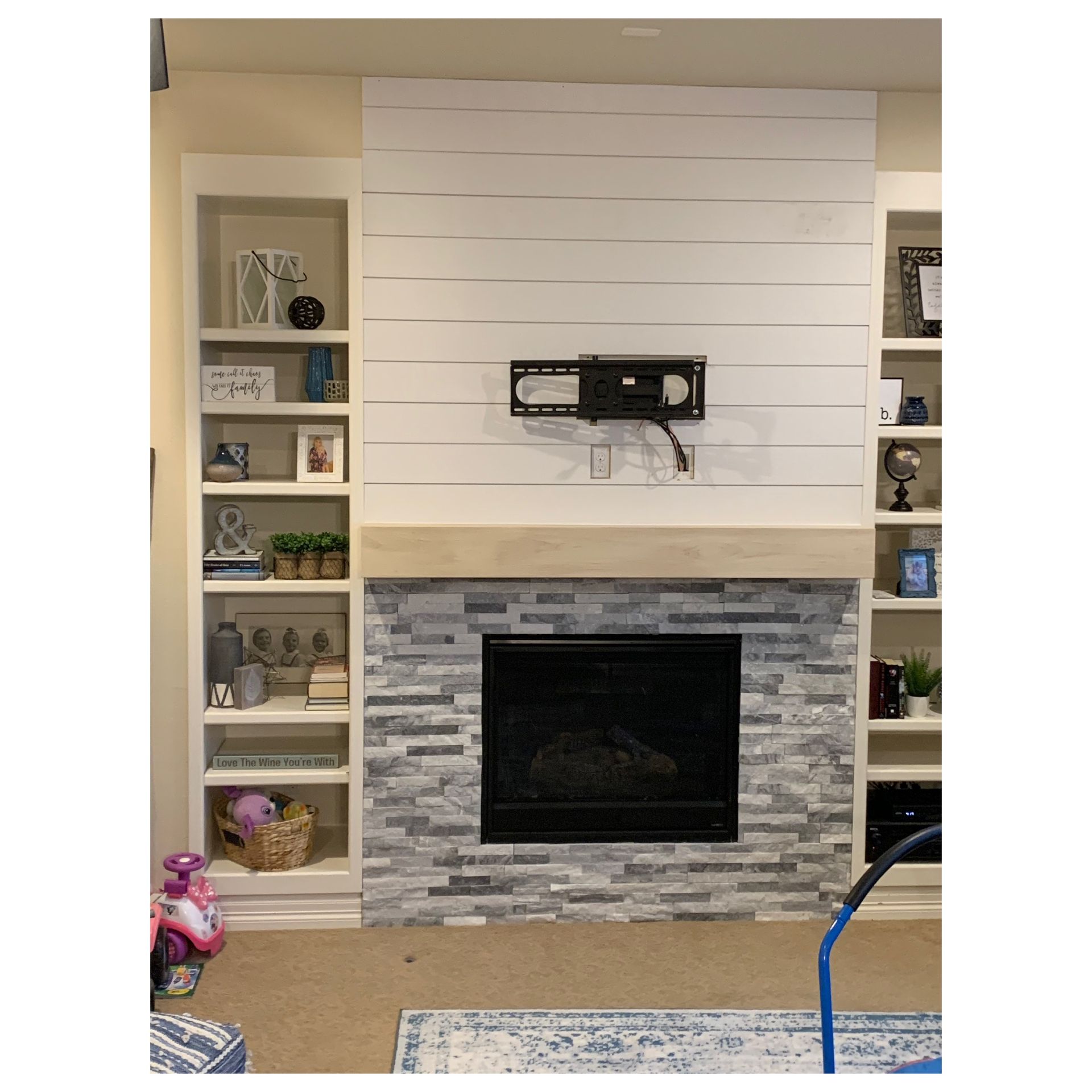 Updated entertainment center area, new stone, shiplap and white oak mantel