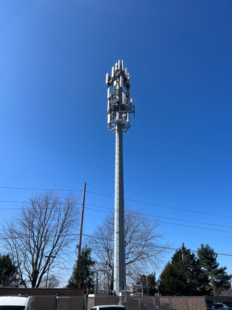 A very tall tower with a lot of antennas on it.