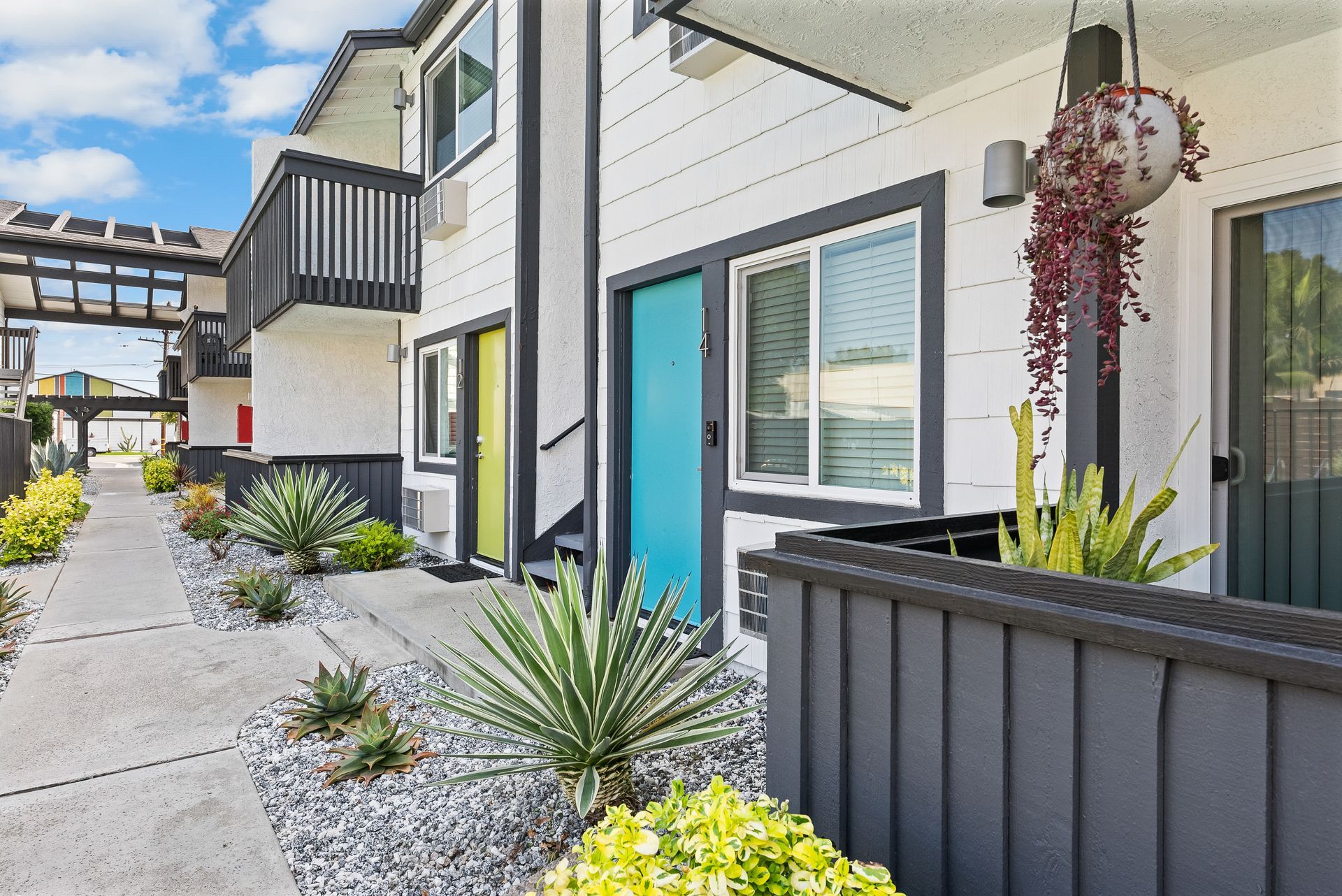Blue front door with lower patio