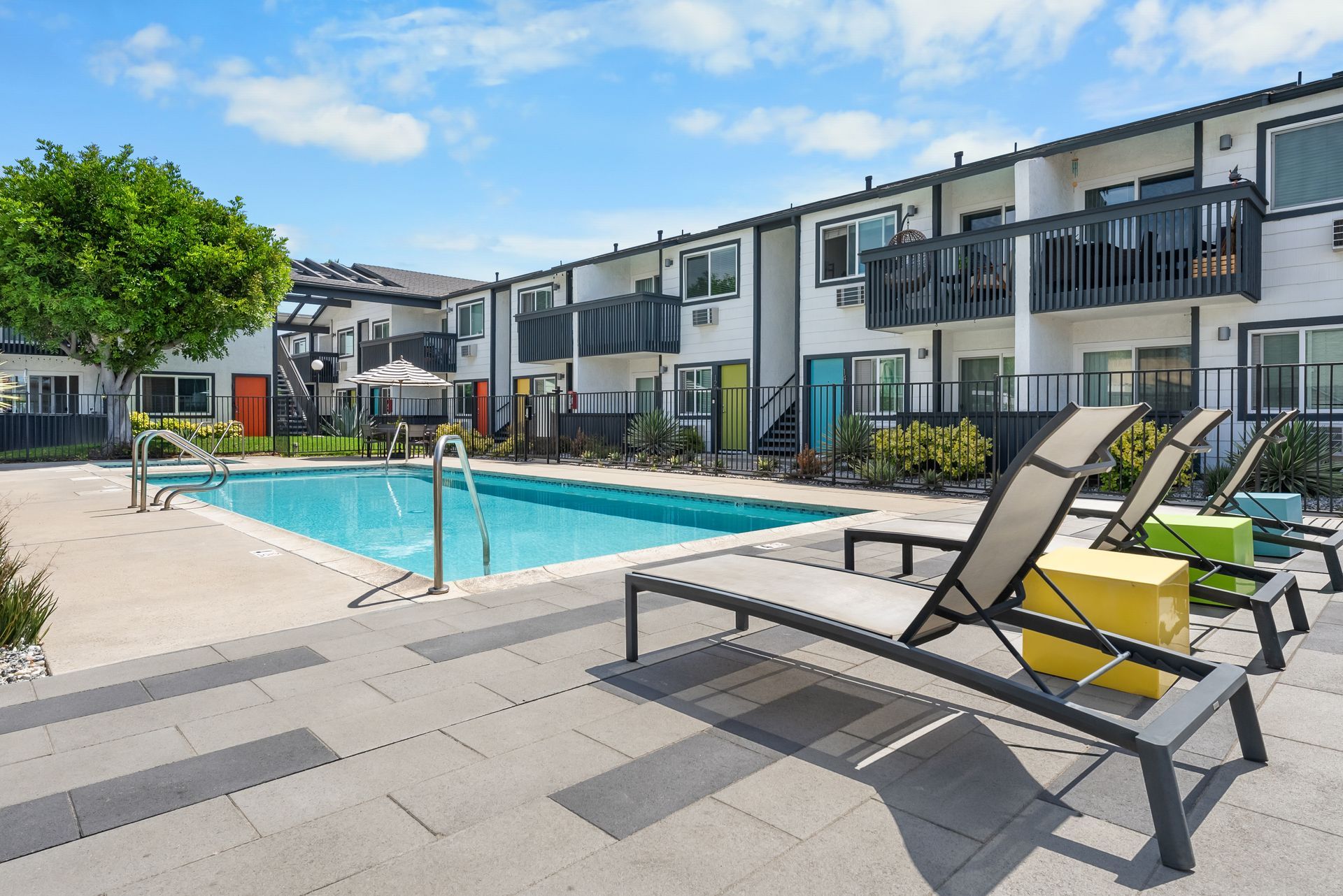 Sliding Photo Gallery Displaying Community Amenities - swimming pool and lounge chairs