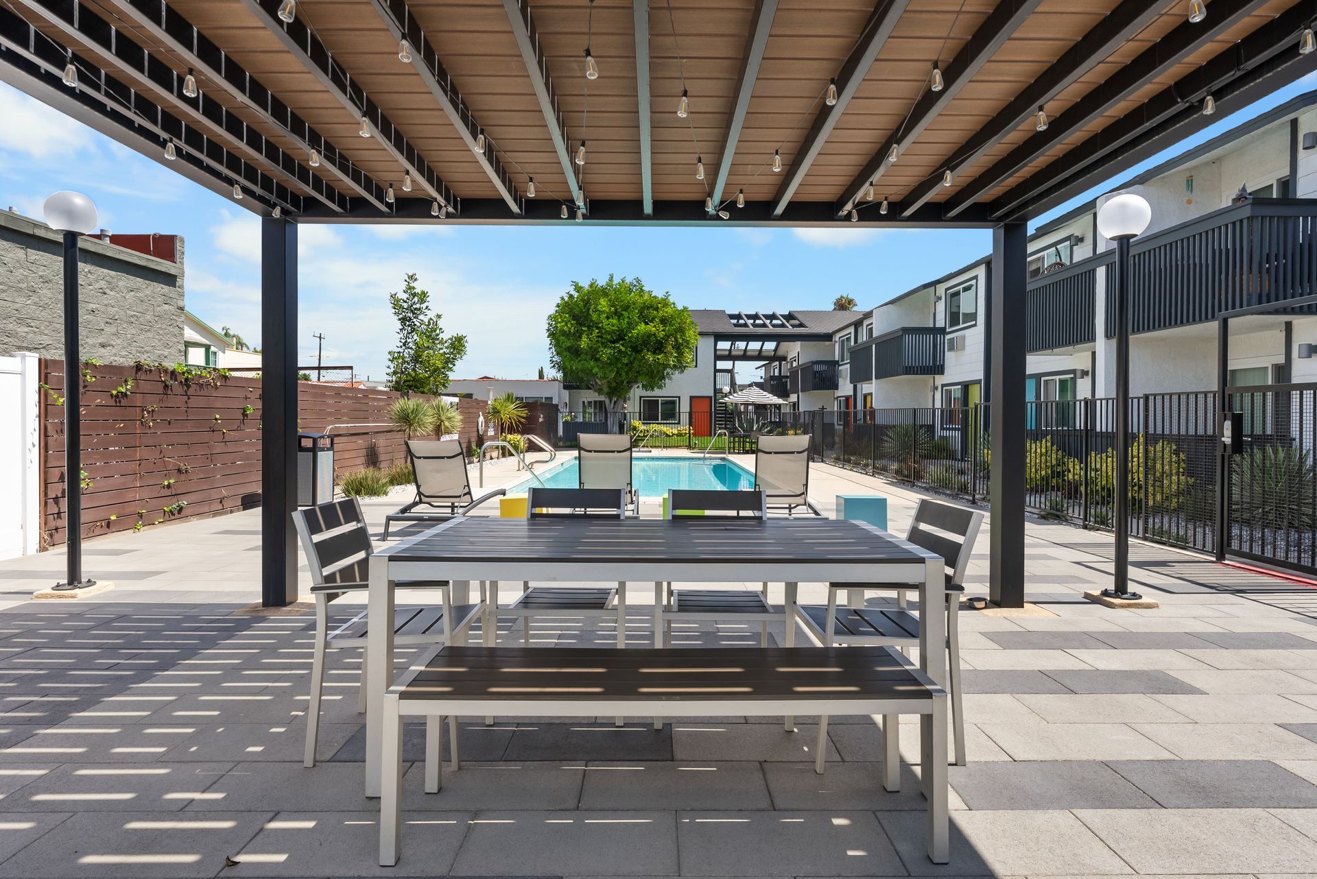 Sliding Photo Gallery Displaying Community Amenities - picnic table and pool