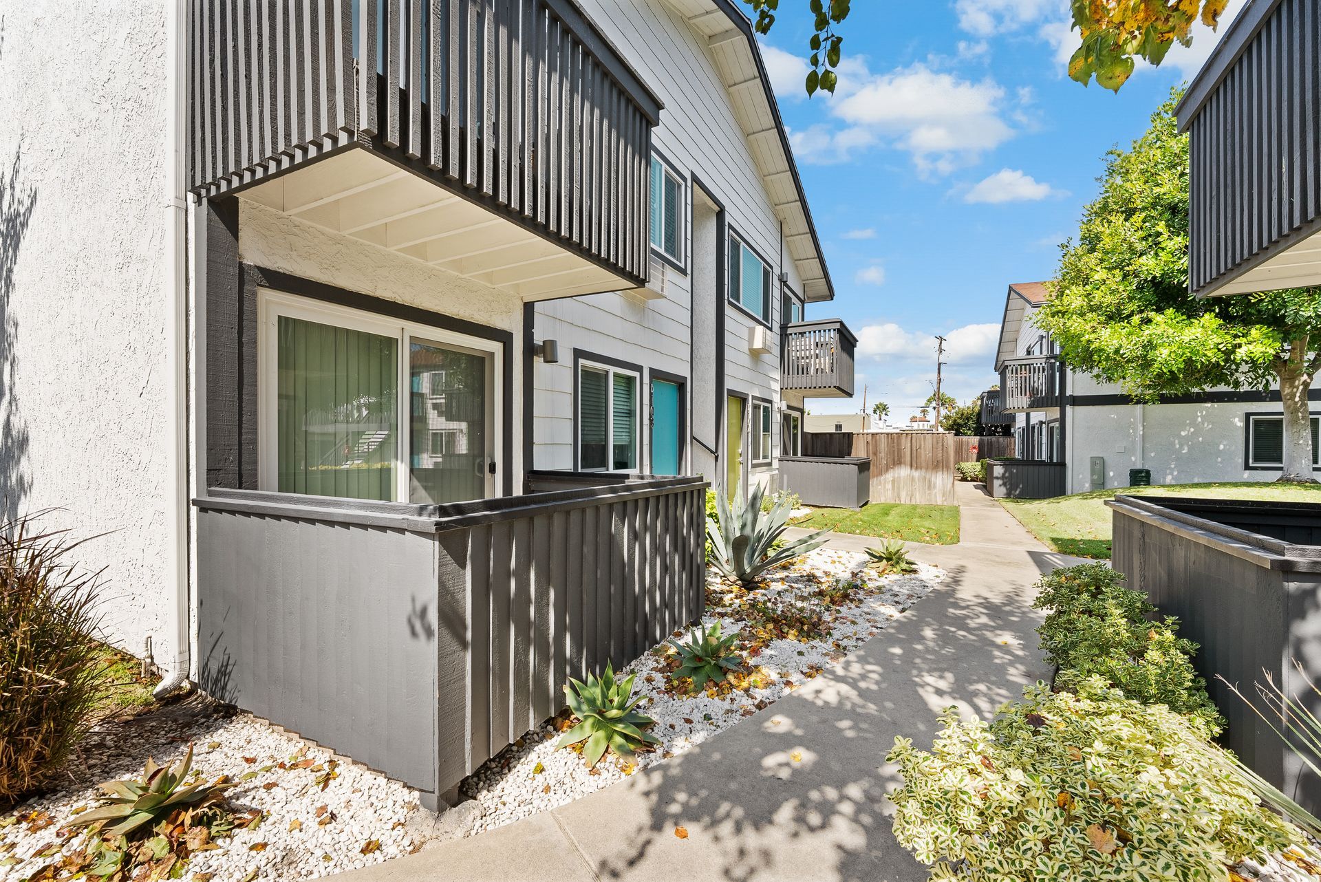 Exterior front doors and two stories of patios