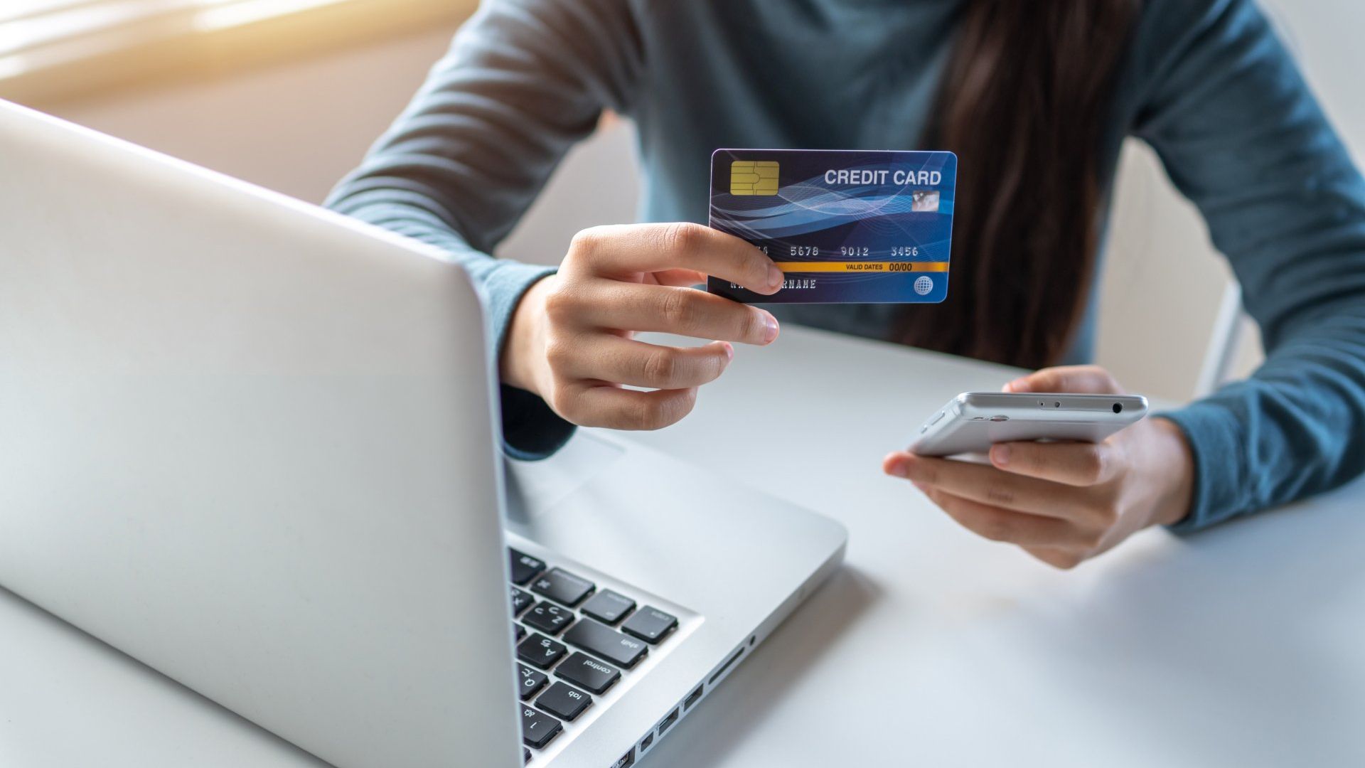 woman paying credit card online