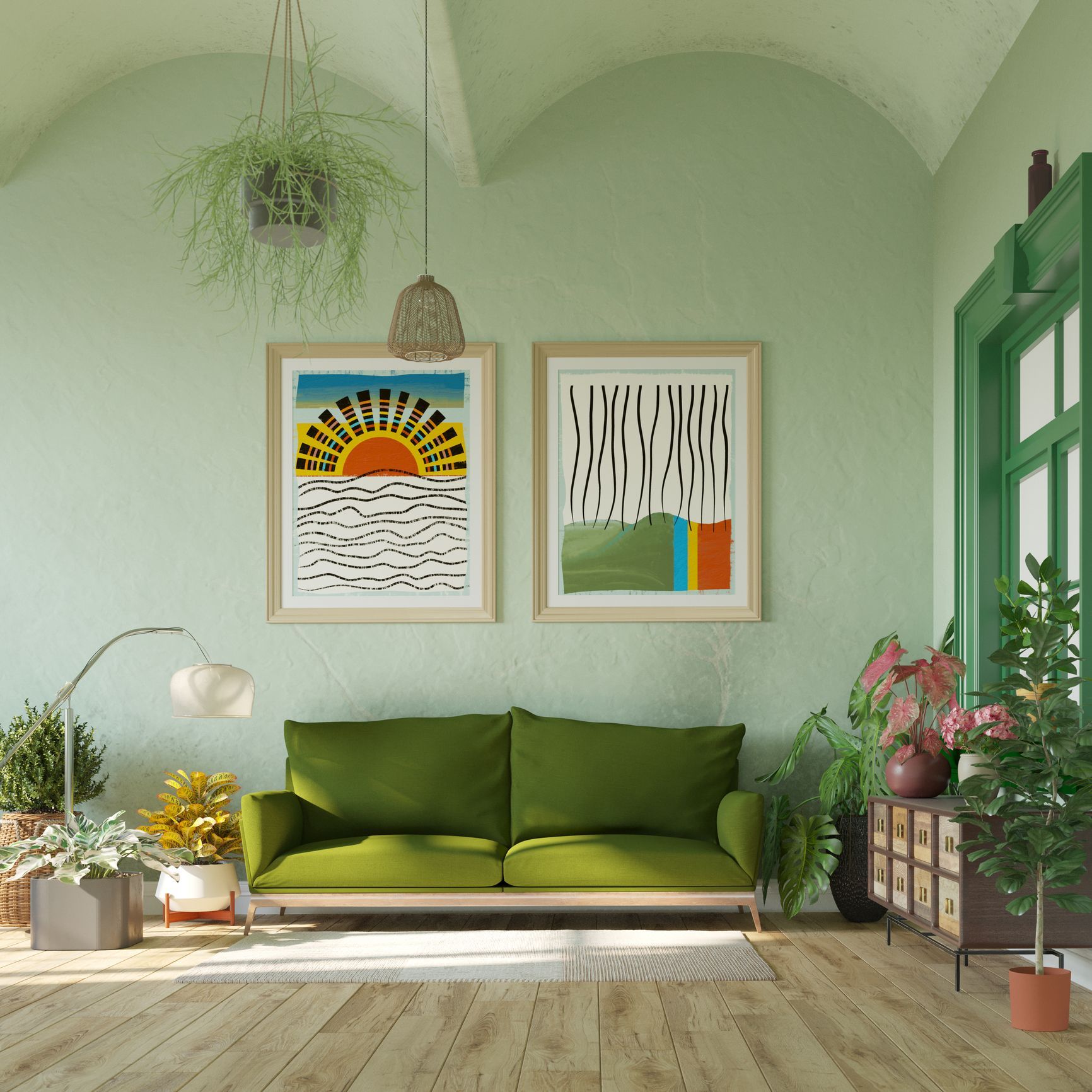Green-themed living room with a green couch, art, plants, and a green-framed window.
