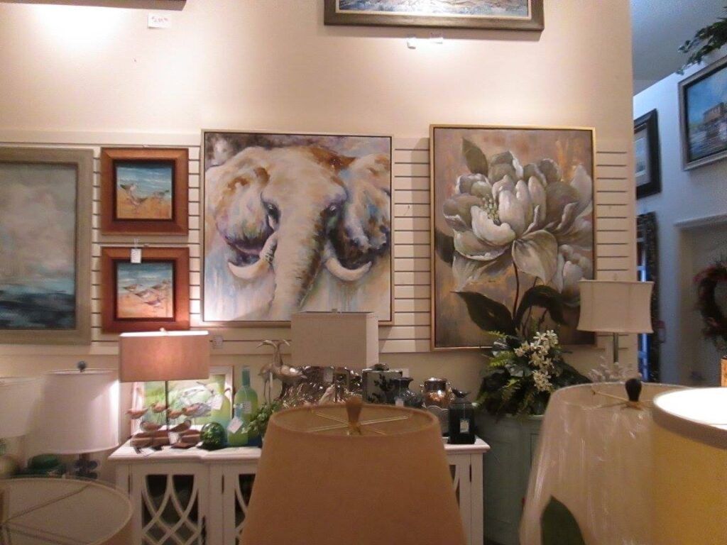 Display of various lamps with different shapes and shades in a showroom.