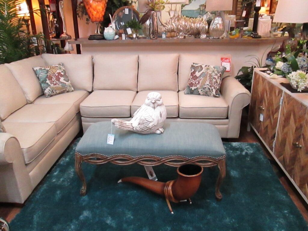 Blue rug with white trellis pattern displayed in a store.