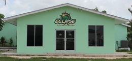 A green building with a sign that says eclipse on it.