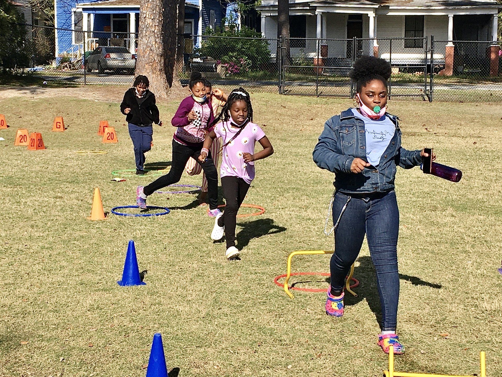 Group of kids playing games outdoors at Boys & Girls Club