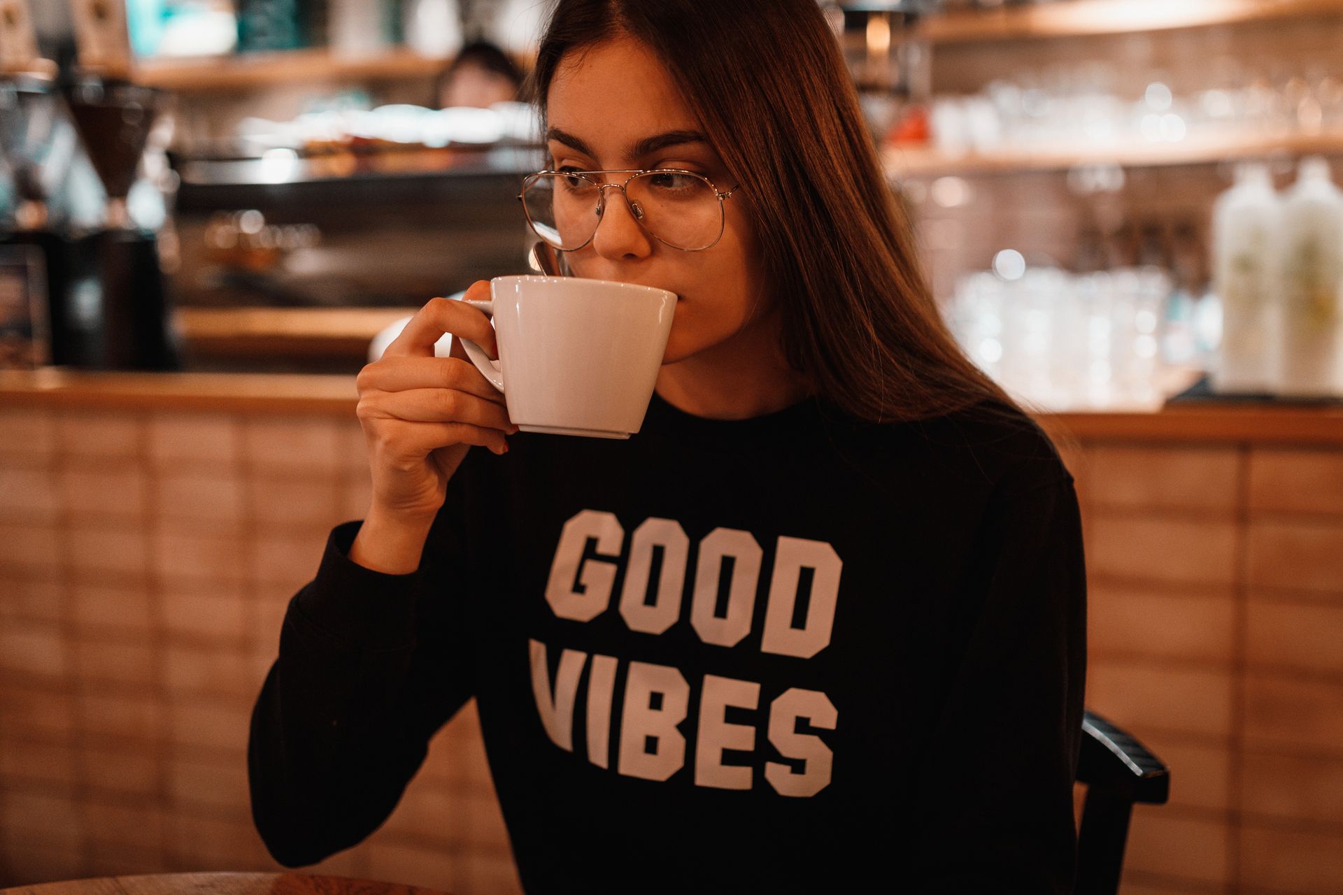 Man browsing suits on a rack in a clothing store.