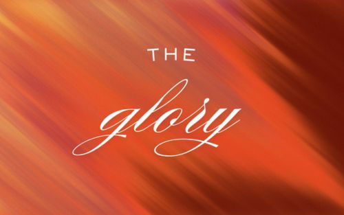 Group of people reading books, seated in a room, focused on texts.