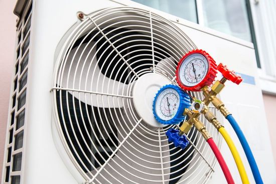 A man is carrying a bag of tools and a couple of gauges.