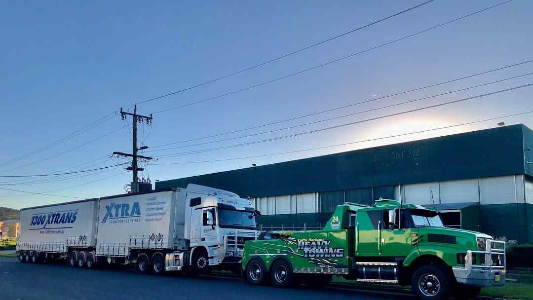 Towing Truck Loaded a White Trailer Truck — Reliable Towing Services in Coffs Harbour, NSW