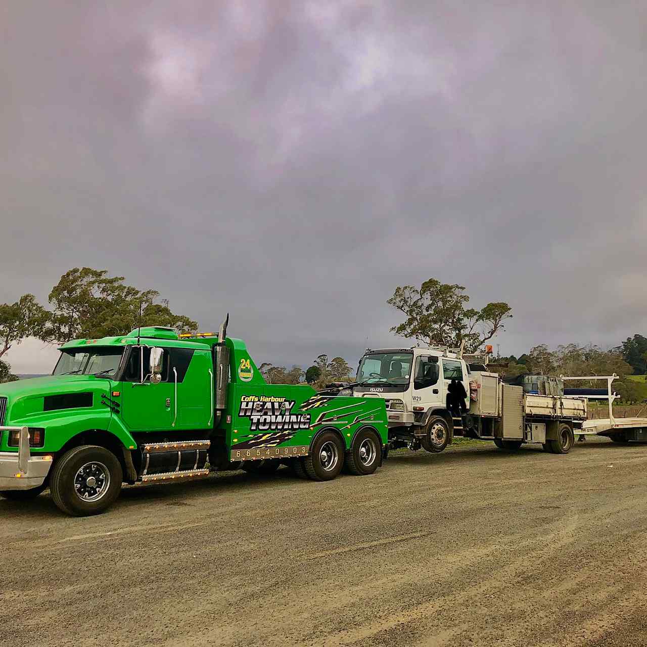 Tow Truck Pulling Truck — Reliable Towing Services in Coffs Harbour, NSW