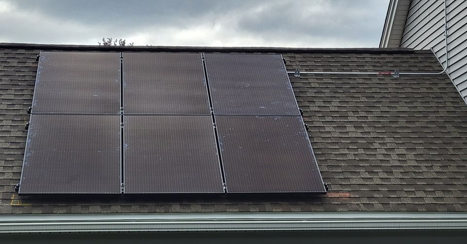 A roof with a lot of solar panels on it