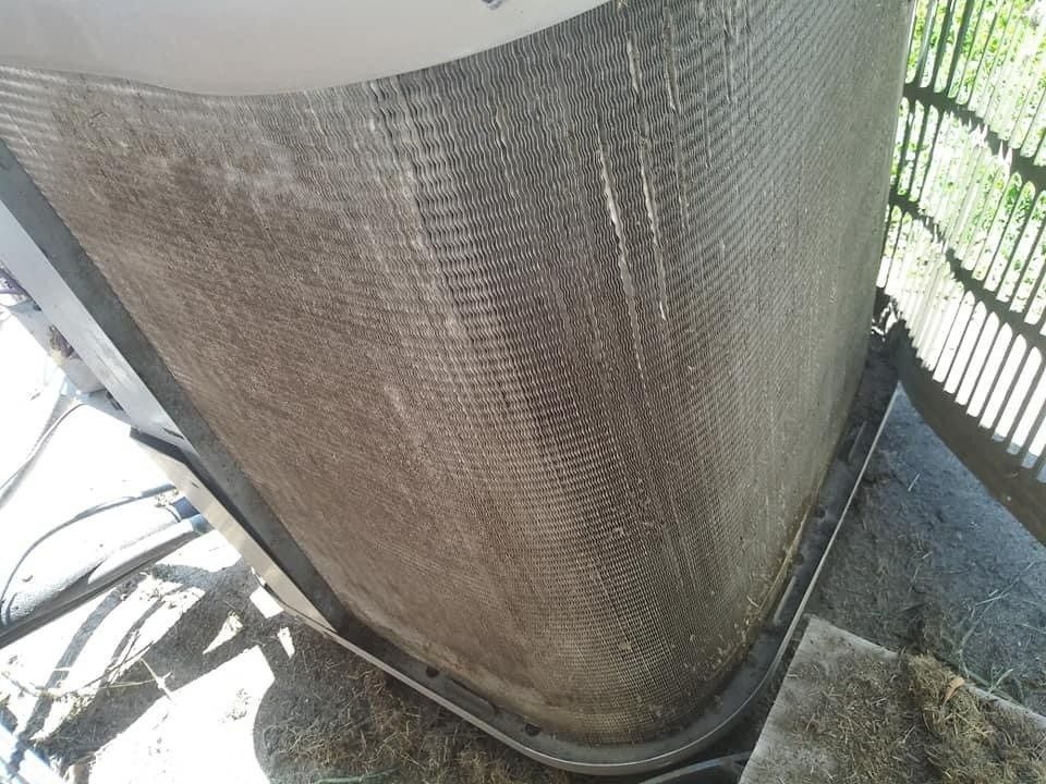 Dirty air conditioner condenser coil. Grey, dusty, outdoor.