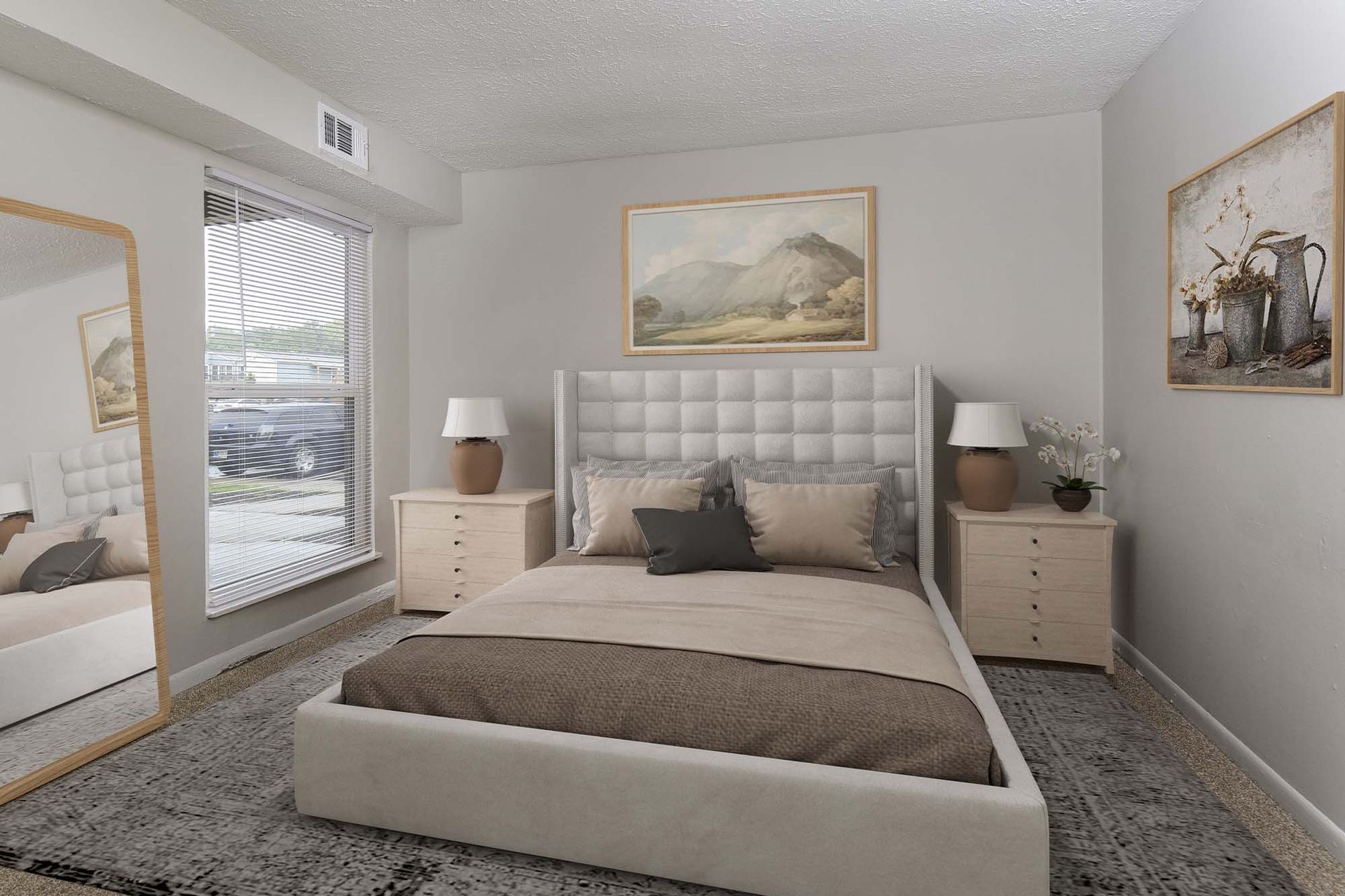 Bedroom in a furnished apartment with a tufted bed and two nightstands.