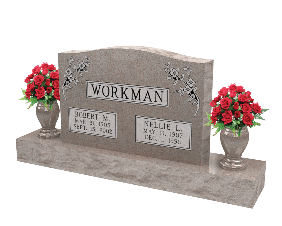 An example of a double upright monument in a light brown granite shown with red flowers in vases on both sides.