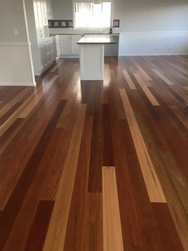 There is a Kitchen in the Background and a Wooden Floor in the Foreground — Coastline Floor Sanding in Point Frederick, NSW