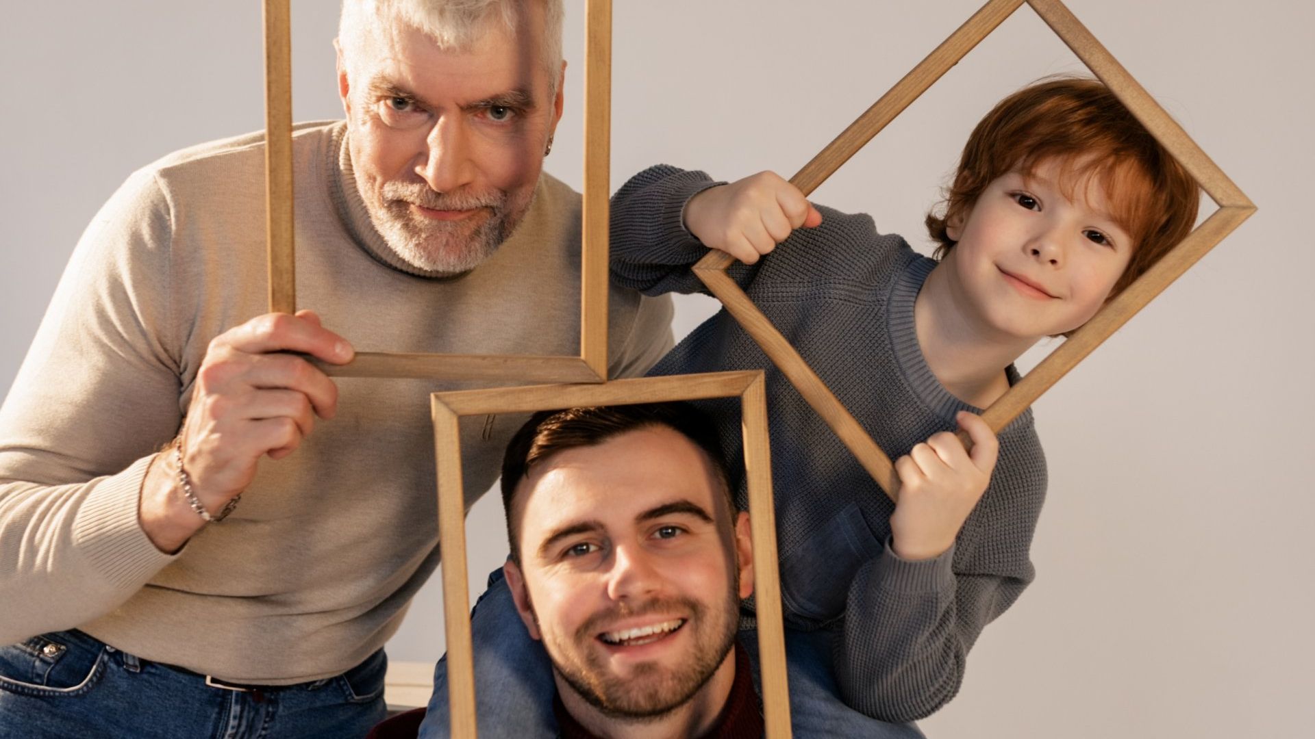 three guys posing for a family photo session with Charlotte family photographer