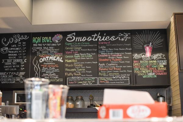 A chalkboard with the word smoothies on it