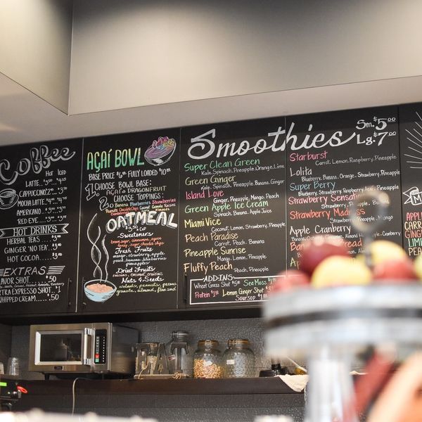A chalkboard with the word smoothies on it